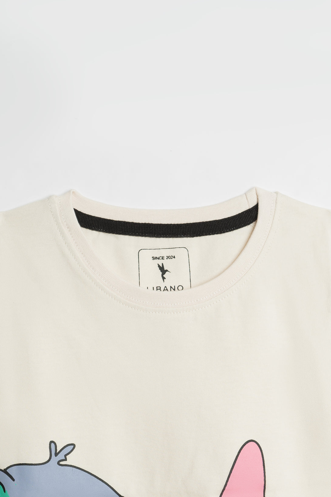 Buy Classic Off-White Girls' Tee with Artful Stitch in Pakistan