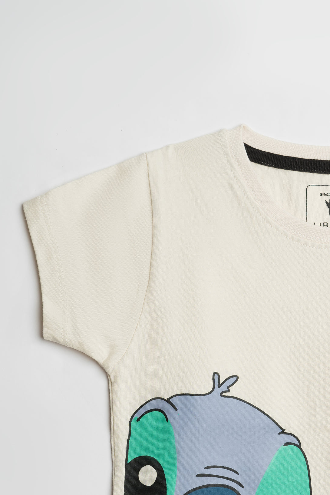 Buy Classic Off-White Girls' Tee with Artful Stitch in Pakistan